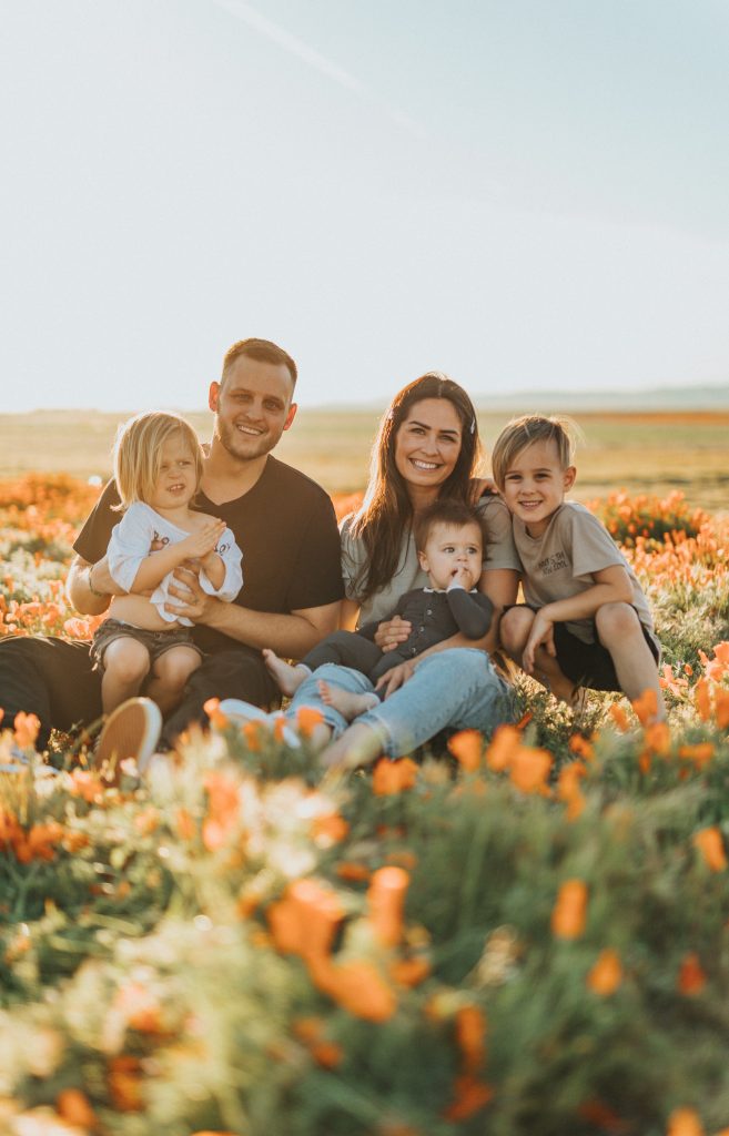 Family in field of flowers