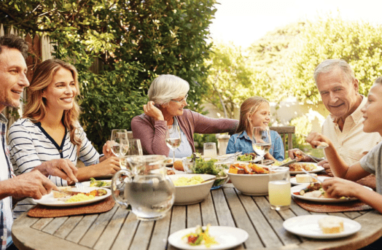 multi-generational family at a picnic table