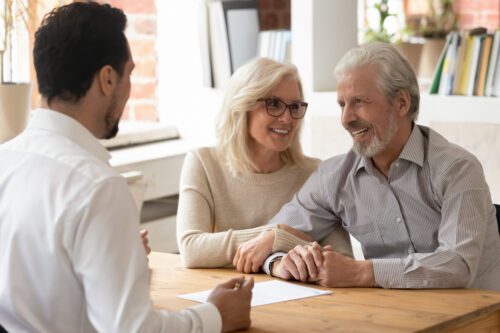 wealth consultant reviewing paperwork with a couple