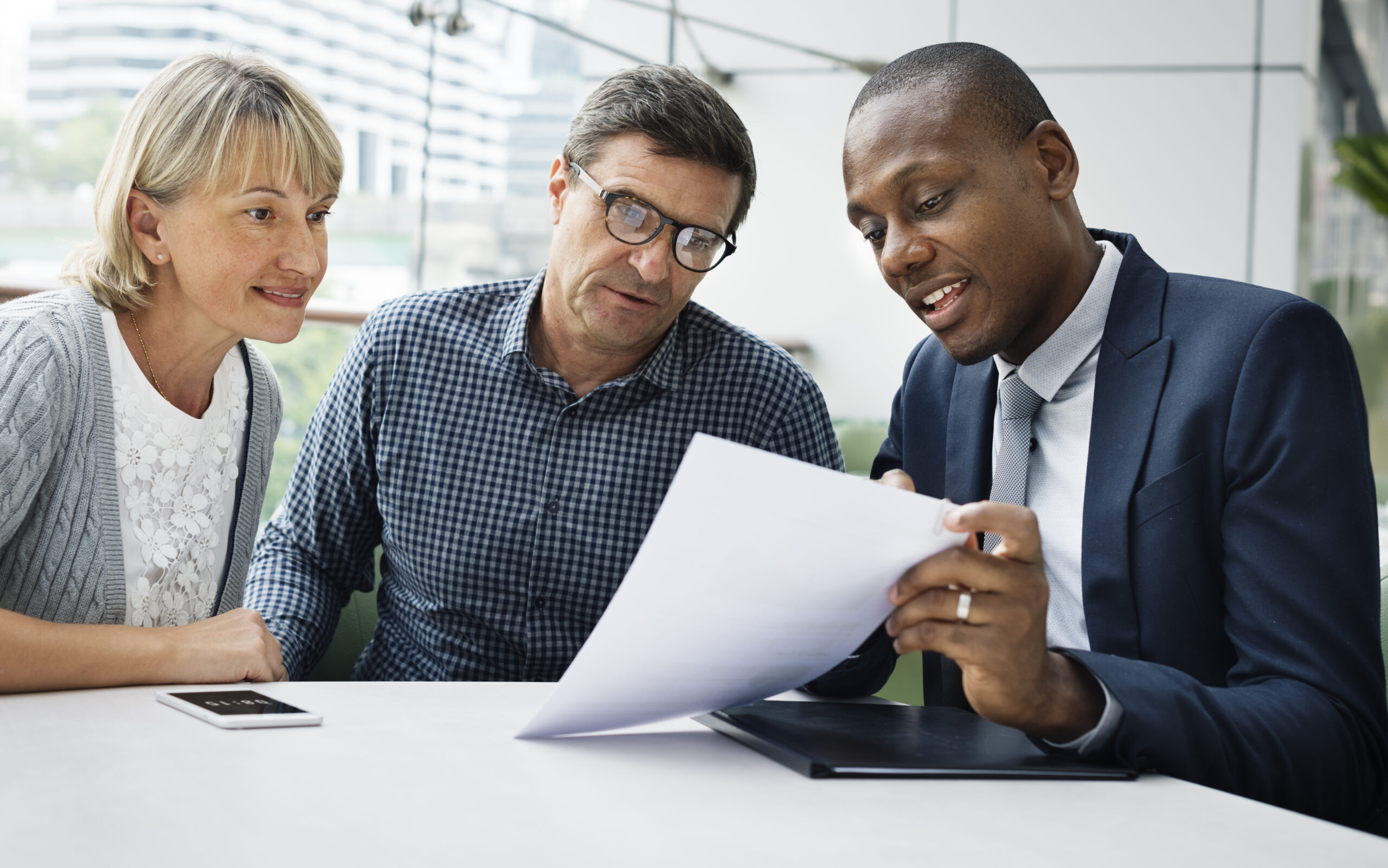 consultant showing couple paperwork